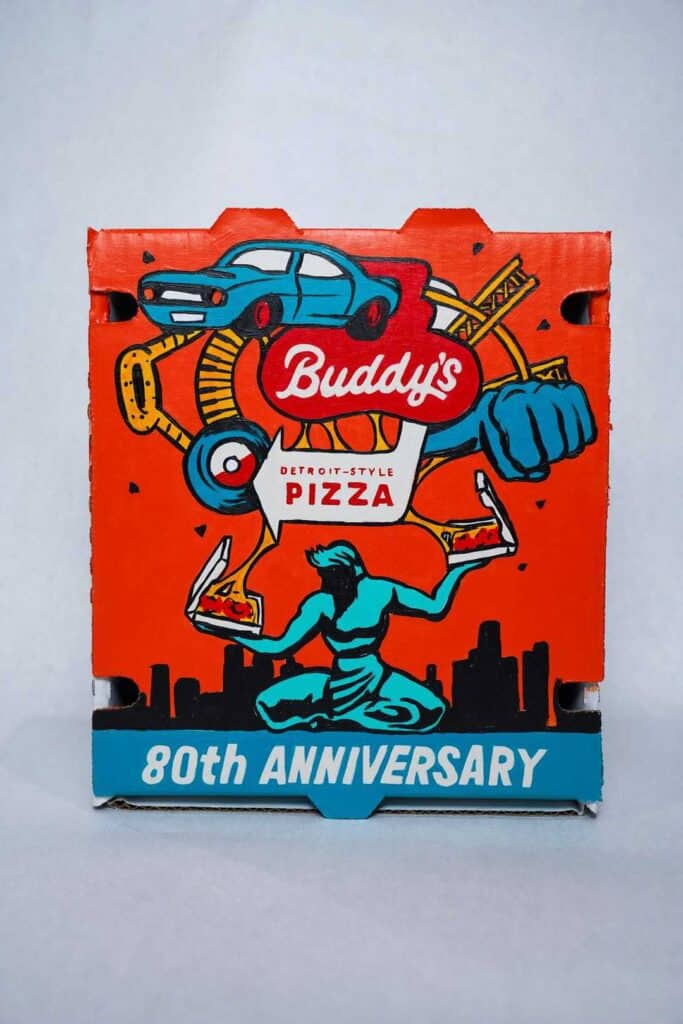 Vintage Buddy's Pizza box celebrating 80th anniversary with Detroit-style design.