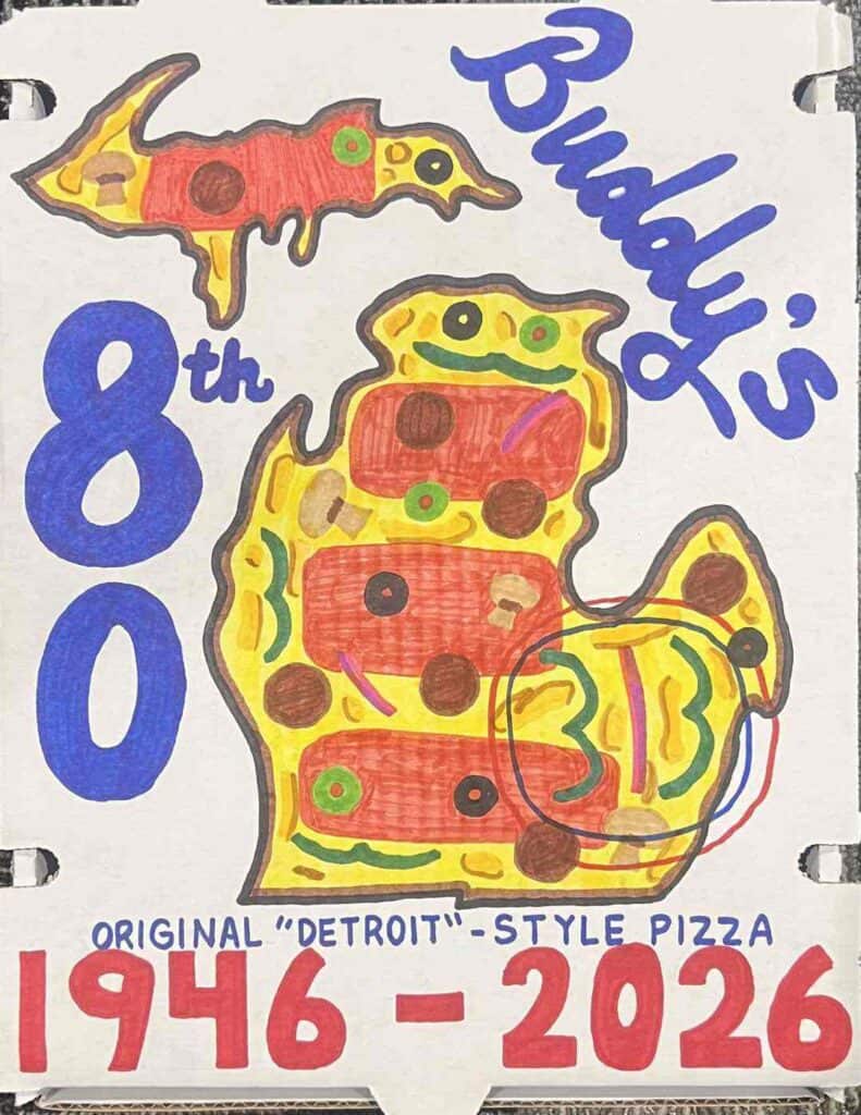 Buddy's Pizza Detroit-style pizza with colorful toppings.