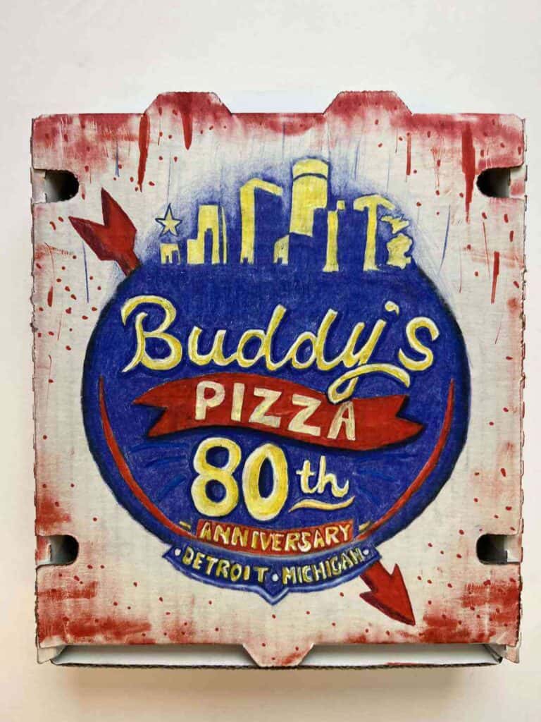Buddy's Pizza 80th anniversary sign celebrating Detroit's pizza tradition.