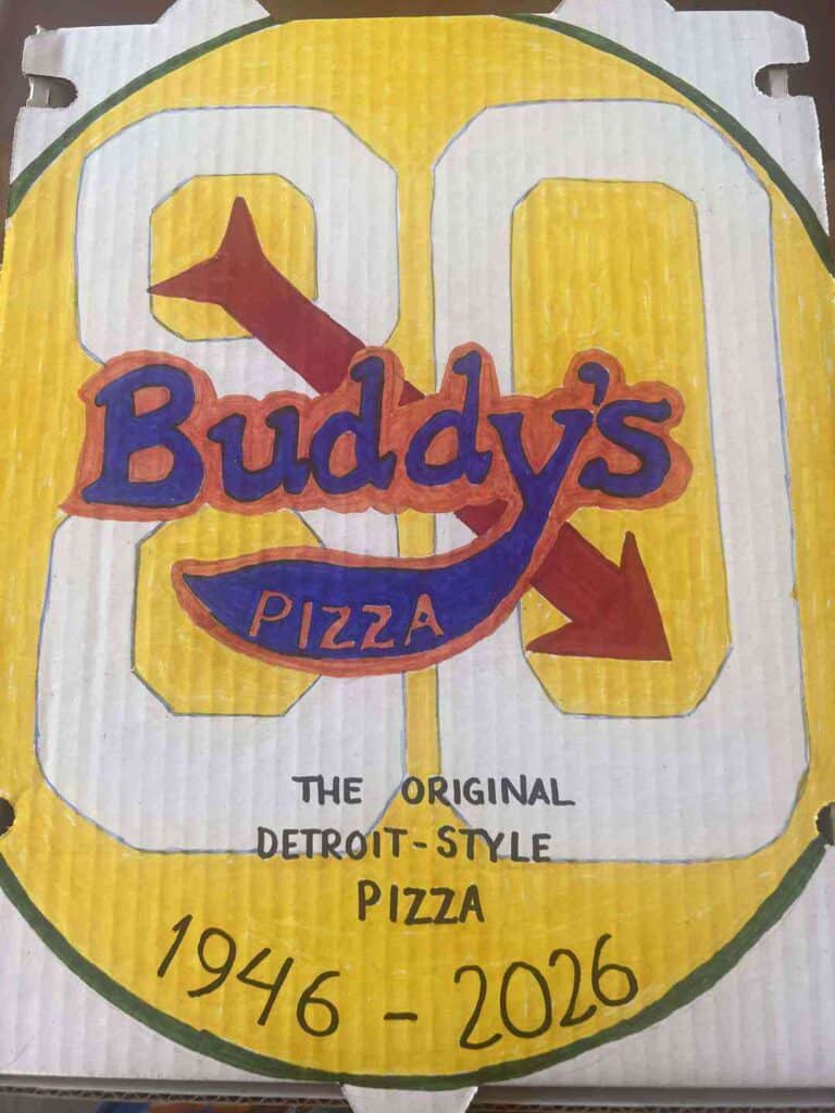Buddy's Pizza logo with a stylized arrow and text, celebrating 70 years.